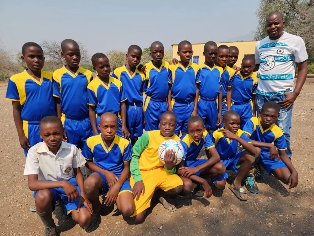 Tsenga Primary School football team in blue and yellow kits